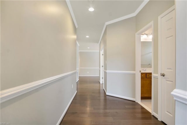 hall featuring ornamental molding and dark hardwood / wood-style flooring