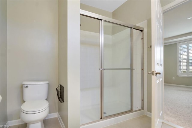 bathroom with toilet and walk in shower