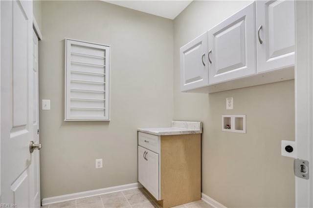 laundry room with washer hookup, cabinets, and hookup for an electric dryer