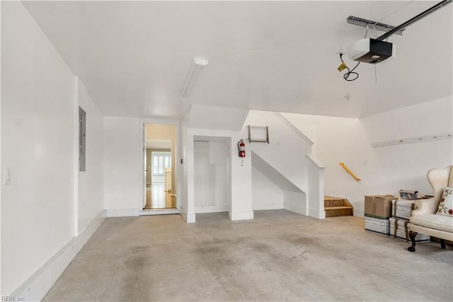 interior space with electric panel and a garage door opener