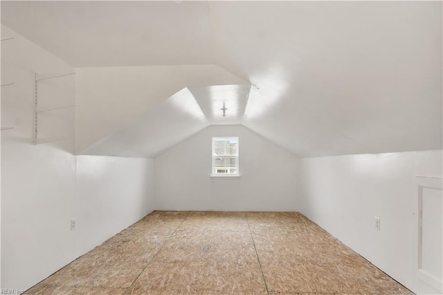 additional living space with lofted ceiling