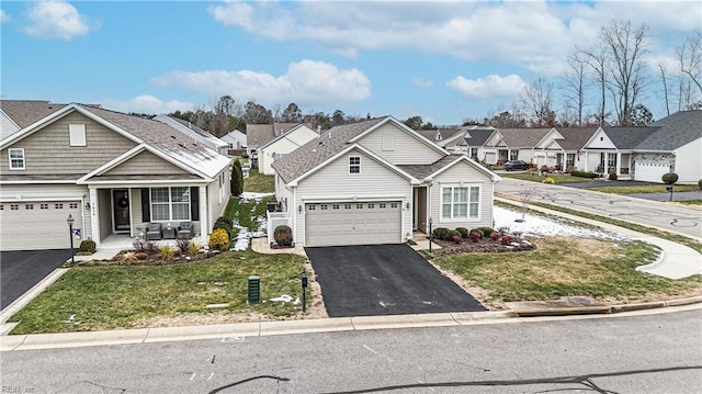 view of front of house featuring a garage and a front yard