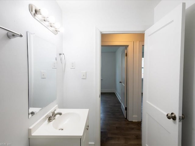 bathroom featuring hardwood / wood-style flooring and vanity