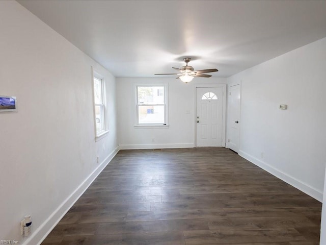 entryway with dark wood-type flooring and ceiling fan