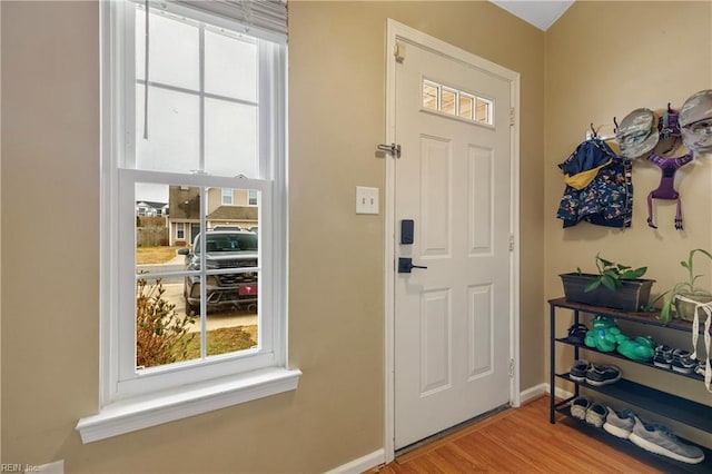 doorway with light wood-type flooring