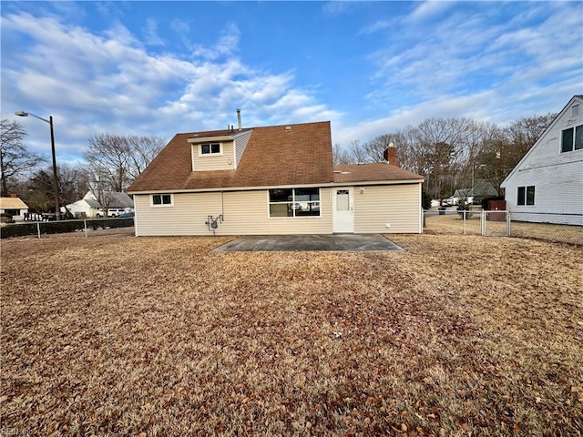 rear view of house with a patio area