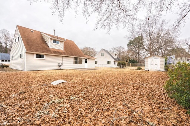 back of property with a storage unit