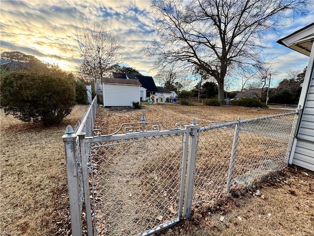 view of yard at dusk