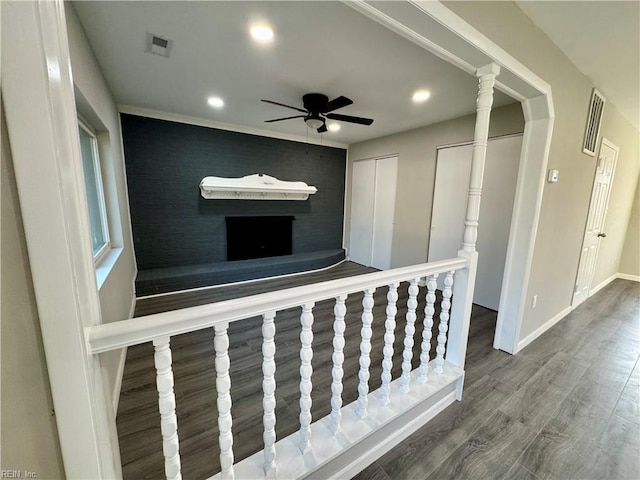 hallway with hardwood / wood-style flooring