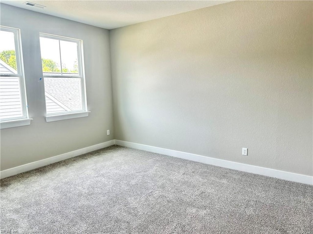 empty room featuring carpet flooring