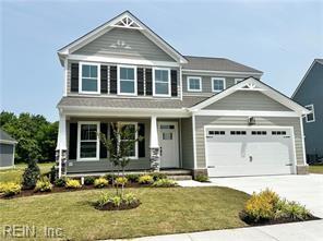 view of front facade featuring a front yard and a garage