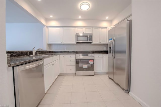 kitchen with stainless steel appliances, white cabinets, and sink