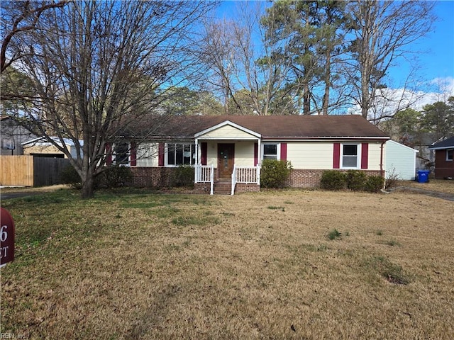 ranch-style home featuring a front yard