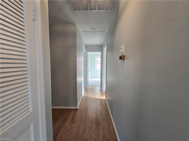 corridor with wood-type flooring