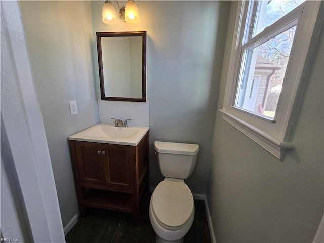 bathroom featuring toilet and vanity