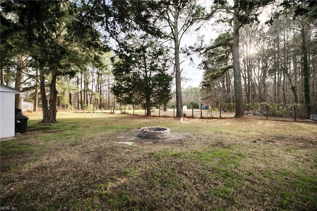 view of yard with an outdoor fire pit