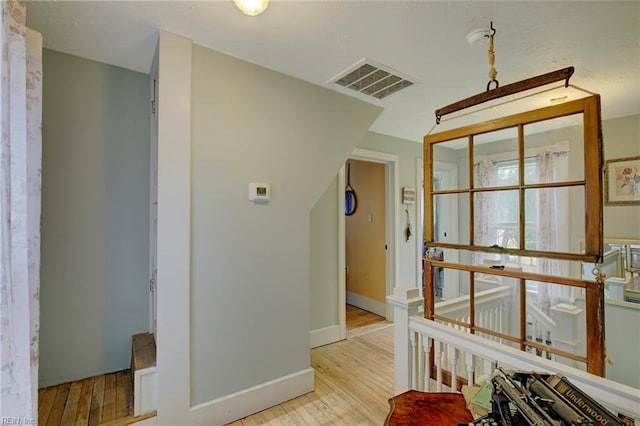 hall with light hardwood / wood-style flooring