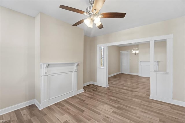 empty room featuring ceiling fan and light hardwood / wood-style flooring