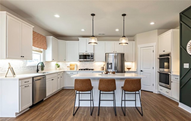 kitchen with appliances with stainless steel finishes and white cabinetry