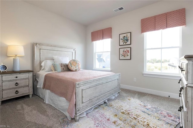 bedroom featuring light carpet