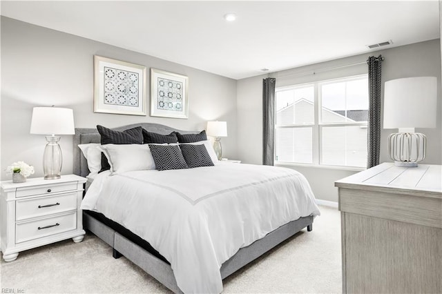 bedroom featuring light colored carpet