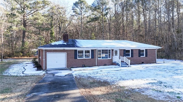 ranch-style home featuring a garage