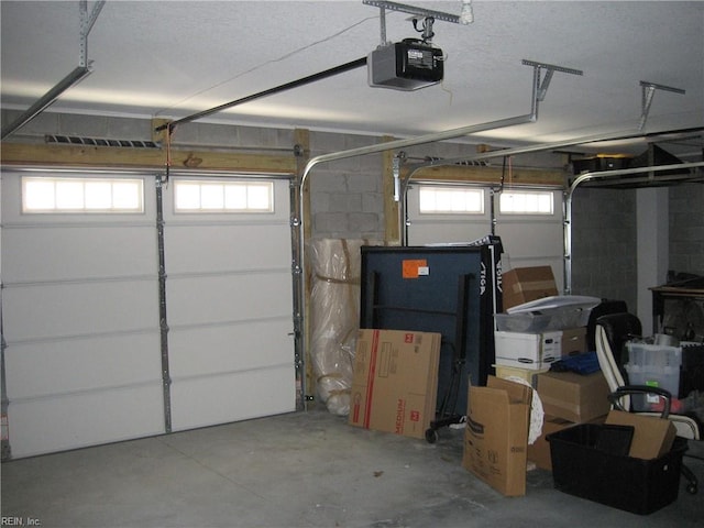 garage featuring a garage door opener