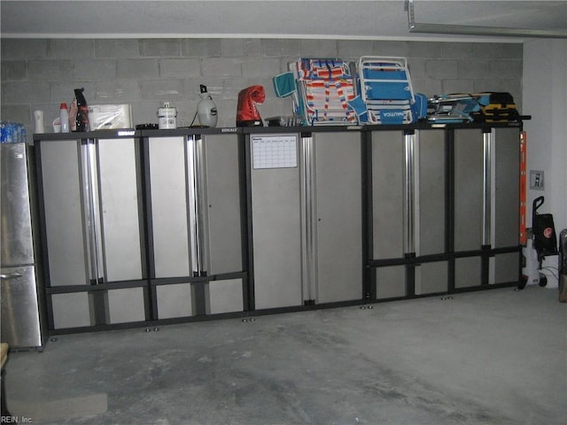 garage featuring stainless steel refrigerator