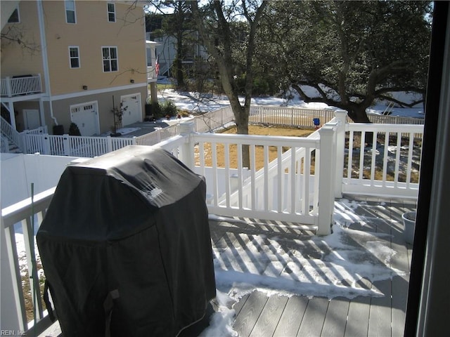 snow covered deck with area for grilling