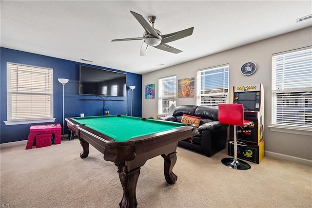 game room with pool table, a wealth of natural light, ceiling fan, and carpet