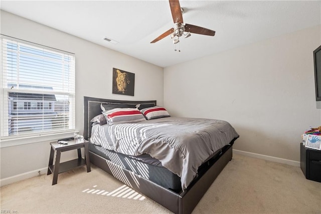 carpeted bedroom featuring ceiling fan