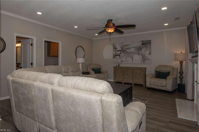 living room featuring a textured ceiling, ceiling fan, ornamental molding, and dark hardwood / wood-style floors