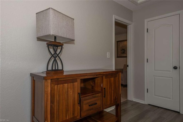 hallway featuring dark hardwood / wood-style flooring