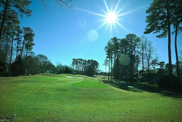 surrounding community featuring a lawn