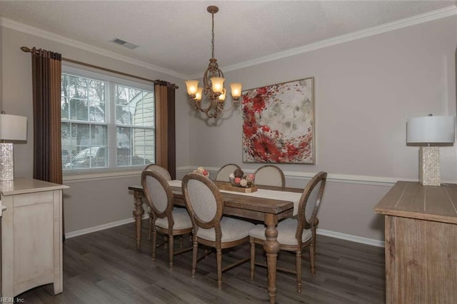 dining room featuring dark hardwood / wood-style flooring, crown molding, and a chandelier