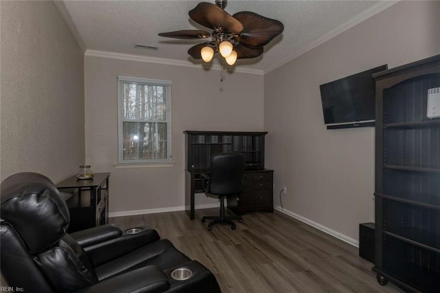 home office with a textured ceiling, ceiling fan, crown molding, and hardwood / wood-style flooring