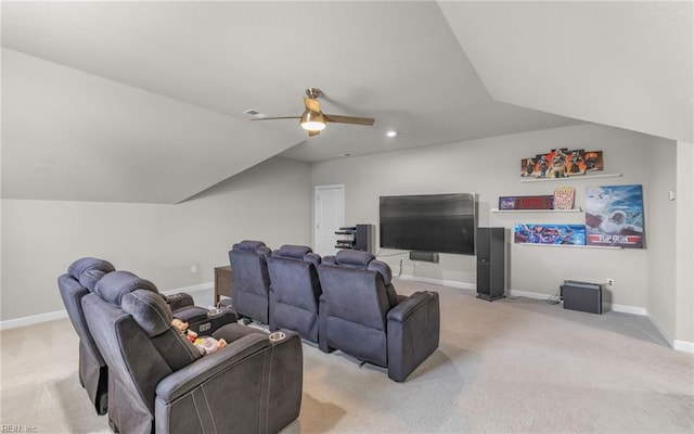 home theater featuring lofted ceiling, ceiling fan, and light carpet