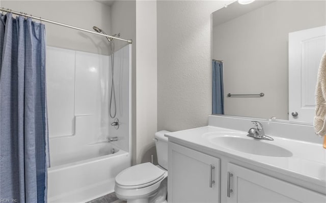 full bathroom with shower / bath combo with shower curtain, toilet, and vanity