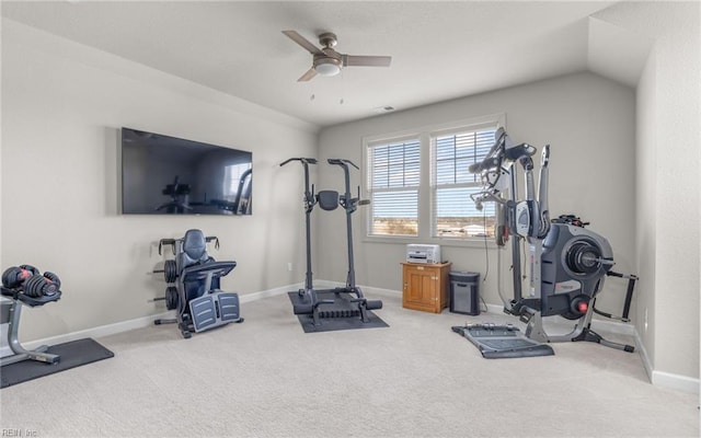 exercise area featuring ceiling fan, carpet floors, and vaulted ceiling