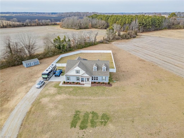 birds eye view of property with a rural view