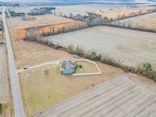 birds eye view of property featuring a rural view