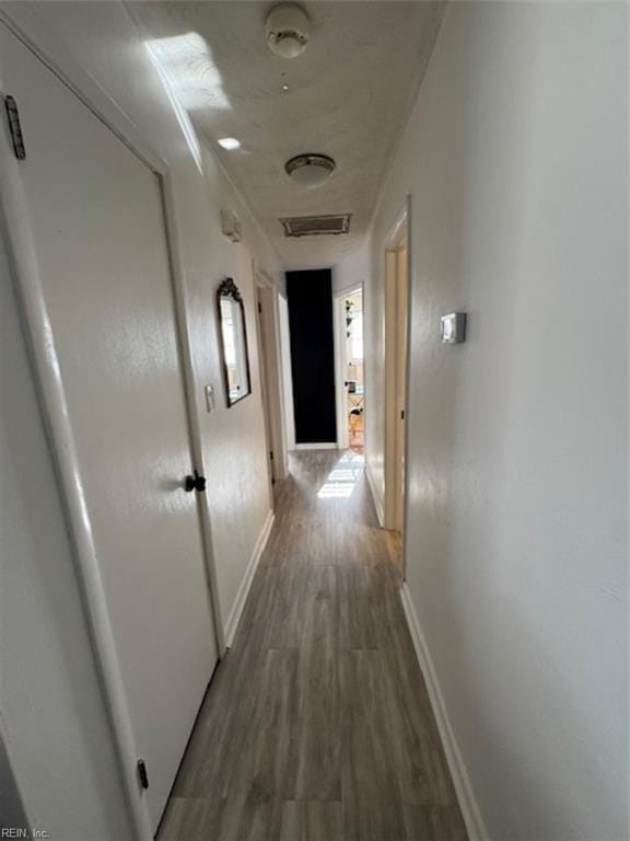 corridor featuring hardwood / wood-style flooring