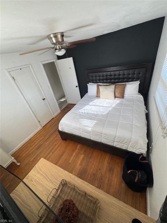 bedroom with ceiling fan and hardwood / wood-style flooring