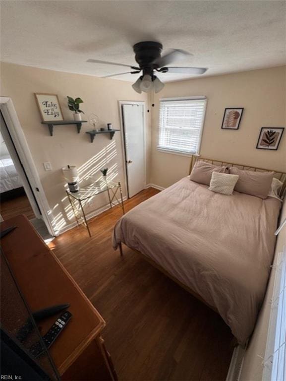 bedroom featuring ceiling fan and hardwood / wood-style floors