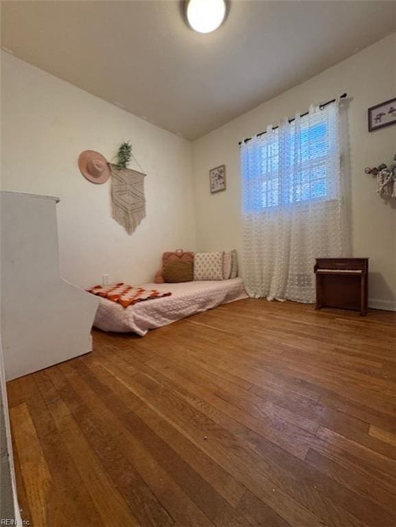 unfurnished room with hardwood / wood-style floors