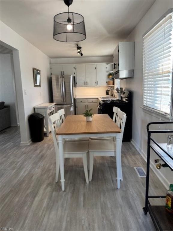 dining area featuring hardwood / wood-style floors