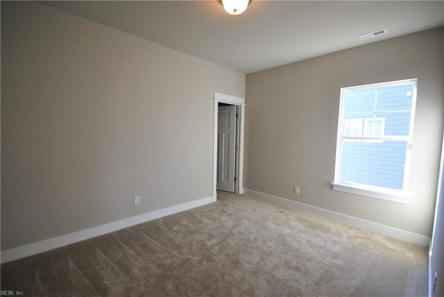 view of carpeted spare room