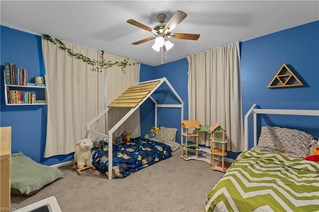 bedroom featuring ceiling fan and carpet