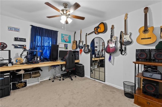 carpeted home office with ceiling fan