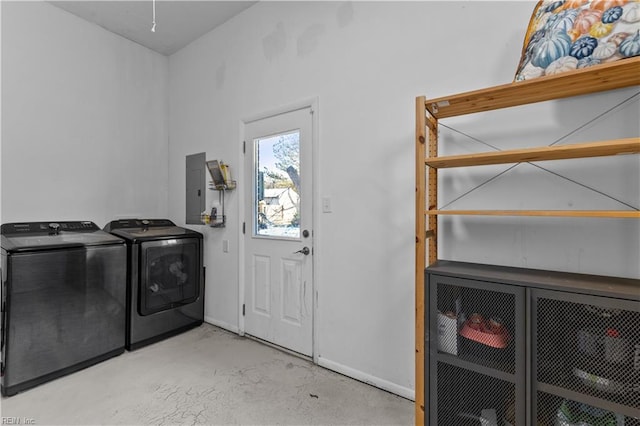 clothes washing area with independent washer and dryer and electric panel